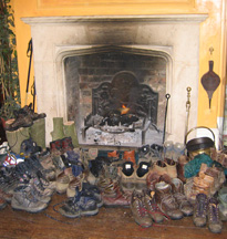 Drying out boots in front of the fire after a long winter walk in the Cotswolds